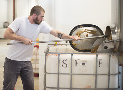 Brewer Noah Cowles was greeted with an abundance of spent grain when he opened the door of the mash tun.